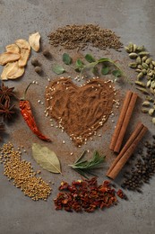 Photo of Flat lay composition of different spices on grey textured table