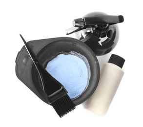 Professional tools for hair dyeing on white background, top view