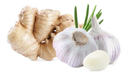 Ginger root, garlic and rosemary on white background