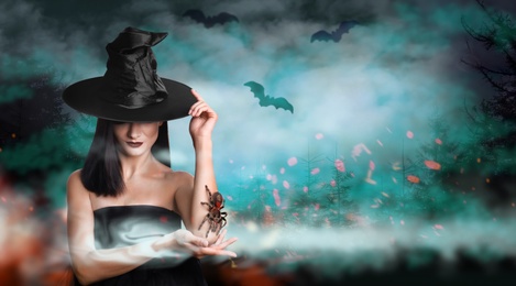 Young girl dressed as witch with creepy spider in misty forest at night. Halloween fantasy