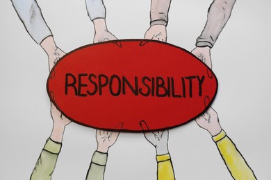 Photo of Drawing of people holding card with word Responsibility on white background, top view