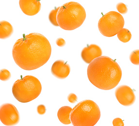 Set of falling fresh juicy tangerines on white background