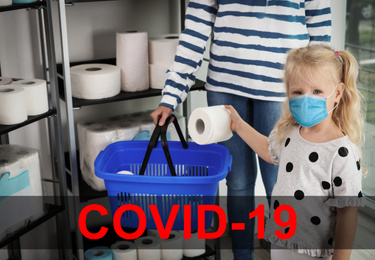 Image of Little girl with medical mask and mother buying toilet paper in shop. Panic of coronavirus outbreak