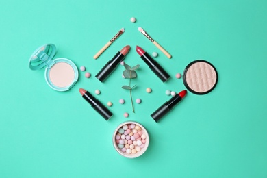Decorative makeup products on color background