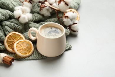 Photo of Composition with hot drink and warm plaid on light table