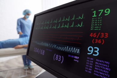 Cardiogram and data on display of heart rate monitor in clinic