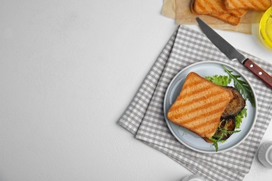 Delicious eggplant sandwich served on white table, flat lay. Space for text