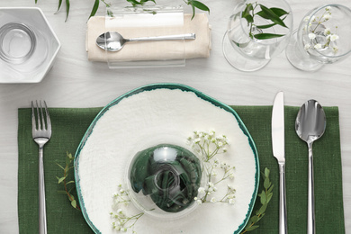 Elegant festive setting on white wooden table, flat lay