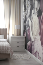 Beautiful floral photoart work used as wallpaper in bedroom interior