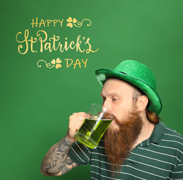 Man drinking green beer on color background. St. Patrick's Day celebration