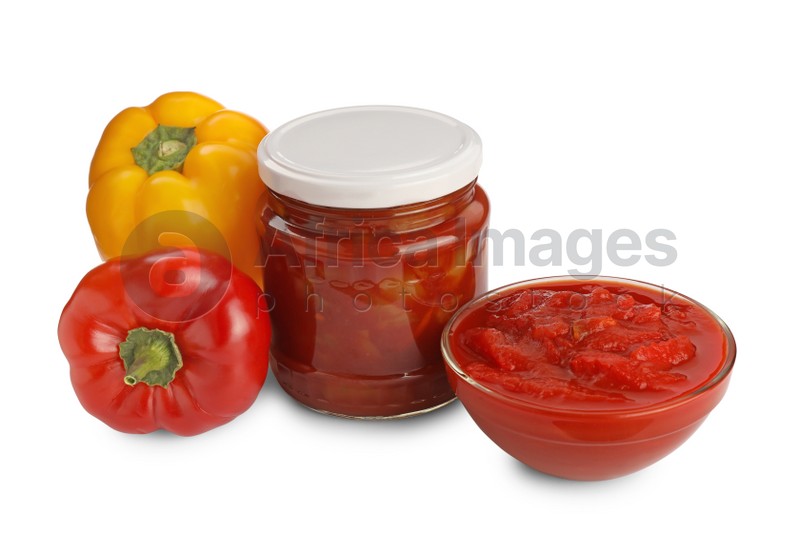 Photo of Delicious lecho and fresh bell peppers on white background