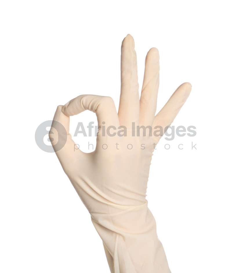 Doctor in medical glove showing OK gesture on white background