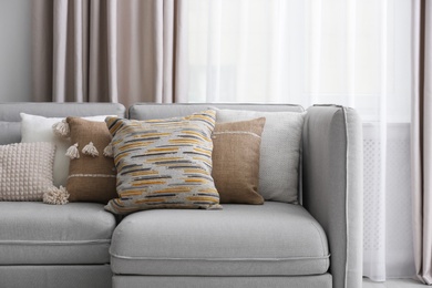Photo of Sofa with pillows in modern living room