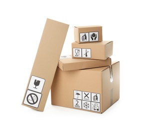 Cardboard boxes with different packaging symbols on white background. Parcel delivery