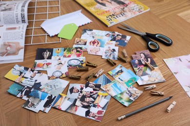 Composition with different photos, magazines and metal grid on wooden background. Creating vision board