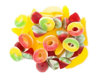 Pile of different jelly candies on white background, top view