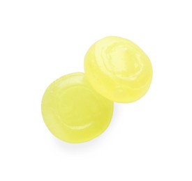 Two yellow cough drops on white background, top view