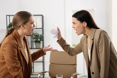Emotional colleagues arguing in office. Toxic work environment