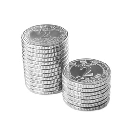 Stacks of Ukrainian coins on white background. National currency