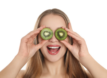 Photo of Young woman with cut kiwi on white background. Vitamin rich food