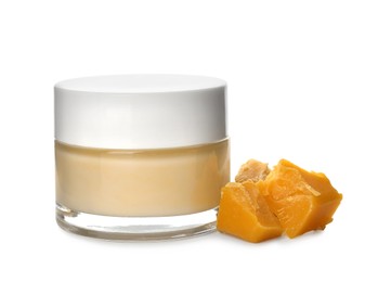 Cream and natural beeswax on white background