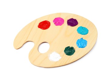 Wooden artist's palette with samples of paints isolated on white
