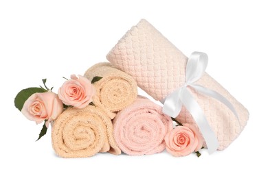 clean soft towels with flowers isolated on white