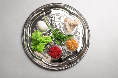 Traditional Jewish plate with symbolic meal for Passover (Pesach) Seder on table, top view