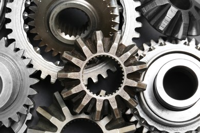 Photo of Many different stainless steel gears as background, top view