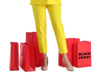 Woman and shopping bags on white background, closeup. Black Friday Sale