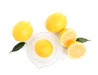 Plastic juicer and fresh lemons on white background, top view