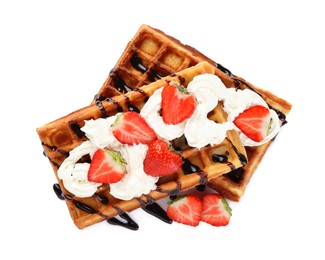 Photo of Delicious Belgian waffles with strawberry, whipped cream and chocolate sauce isolated on white, top view