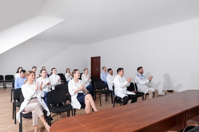 Photo of Team of doctors in meeting room during medical conference