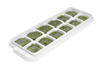 Broccoli puree in ice cube tray isolated on white. Ready for freezing