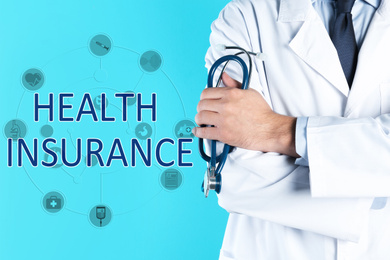 Phrase Health Insurance, icons and doctor with stethoscope on blue background, closeup