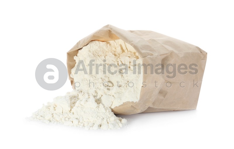 Overturned paper bag of flour isolated on white