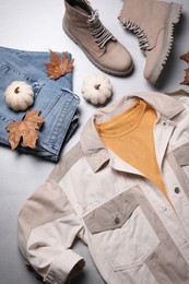 Fall fashion. Layout of women's outfit on light grey background, top view