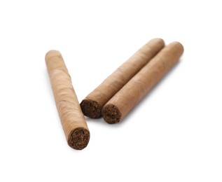 Cigars wrapped in tobacco leaves on white background