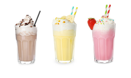Set of glasses with different protein shakes on white background