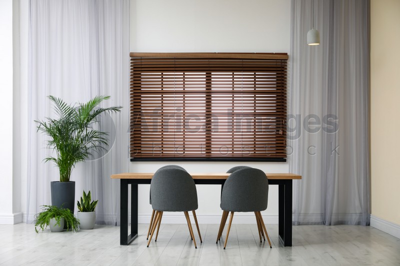 Photo of Modern empty wooden table in room interior