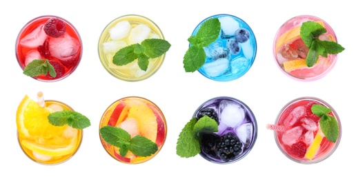 Set of different lemonade drinks made with soda water on white background, top view. Banner design 