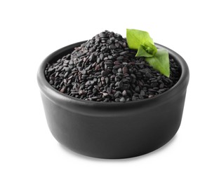 Photo of Black sesame seeds with green leaf in bowl on white background