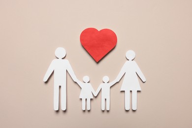 Paper family figures and red heart on beige background, flat lay. Insurance concept