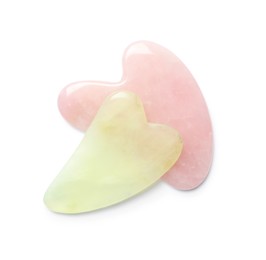 Photo of Jade and rose quartz gua sha tools on white background, top view