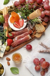 Photo of Set of different delicious appetizers served on white wooden table, flat lay