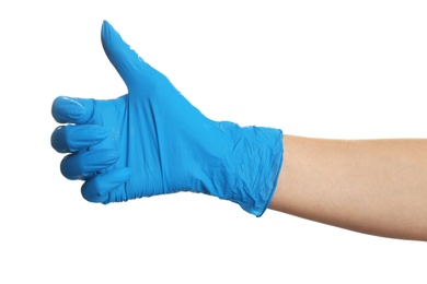 Woman in blue latex gloves holding something on white background, closeup of hand