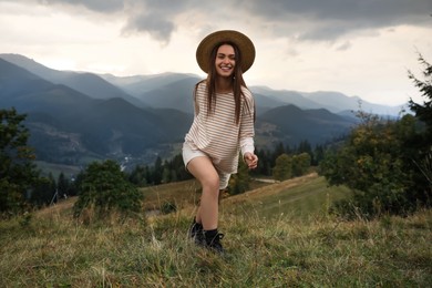 Young woman enjoying her time in mountains