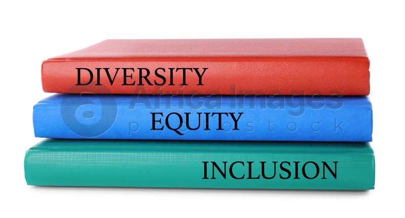 Stack of colorful notebooks with words Diversity, Equity, Inclusion on white background