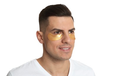 Man with golden under eye patches on white background