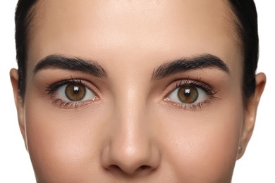 Woman with beautiful hazel eyes on white background, closeup